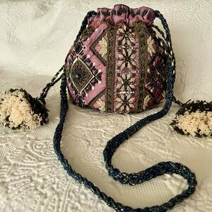 Beaded, tasseled boho bag from Anthropologie. 5x5 w/48 in strap.